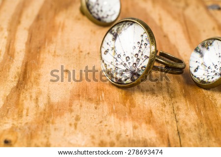 Macro of vintage jewelry set isolated on wood background