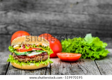 Beef burger, hamburger with grilled meat and vegetables, sandwich, takeaway food