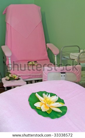 Artificial flowers and manicure chair in beauty salon