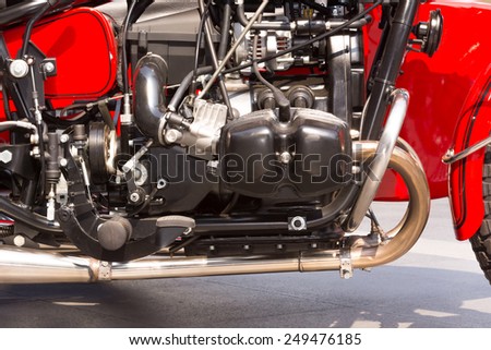 Black motorcycle engine and red motorcycle body