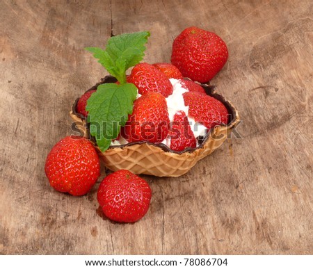 waffle bowl with fresh strawberries and cream
