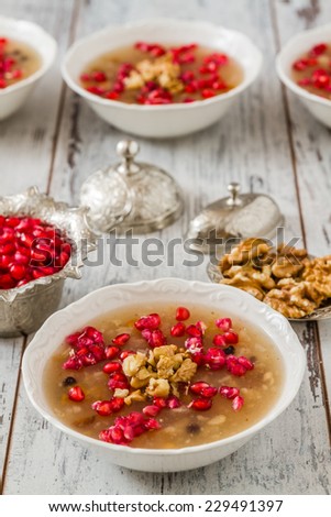 Turkish dessert Ashura, Noah\'s pudding, with pomegranate seeds and walnuts