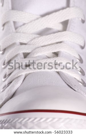 Close up to a white sport style shoe