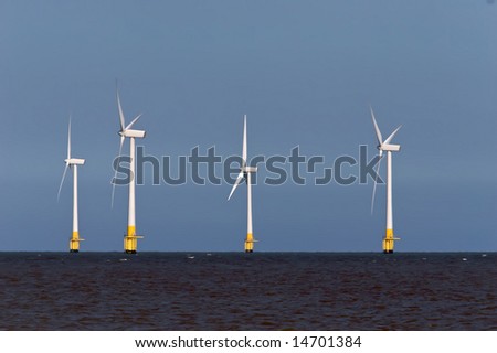 Four Offshore wind turbines in the North Sea.