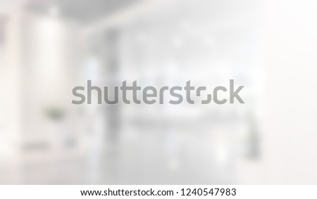 abstract blur contemporary office interior white background with morning shine light effect concept