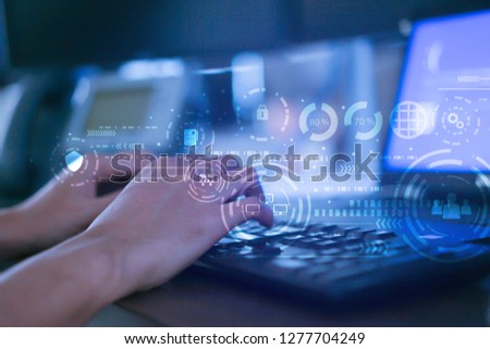 close up programmer man hand typing keyboard input code for register and unlock system password on laptop in darkness operation room with virtual reality interface, cyber security concept