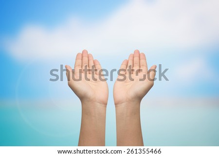 hands open palm gesture showing on blurred sea backgrounds,soft focused