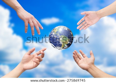Four hands reaching the world for heal together, save the world concept ,Elements of this image furnished by NASA