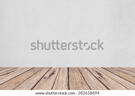 old vintage wooden desk table with white cement backgrounds textured , put and show your products on this backgrounds