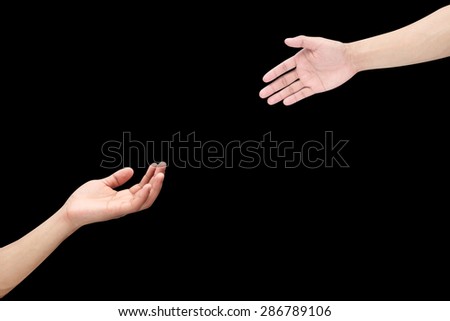 Human\'s hands help together isolated on black backgrounds.helping hand concept.