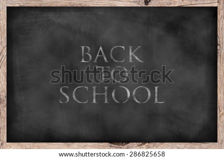 chalk board background textures with message Back to school and old vintage wooden frame ,blackboard concept,back to school concept.