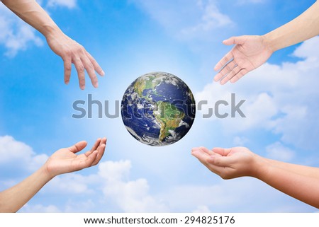 Four hands reaching the world for heal together, save the world concept ,Elements of this image furnished by NASA