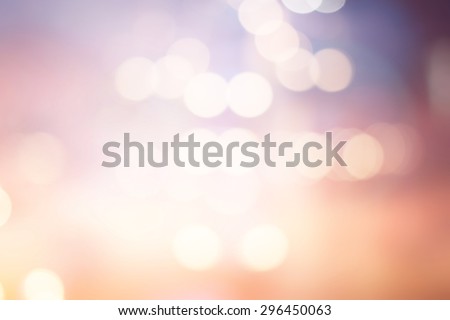 abstract blurred backgrounds of twilight backdrop with circle lights in pastel tone colour.blur of bokeh circle light christmas festive backdrop concept.