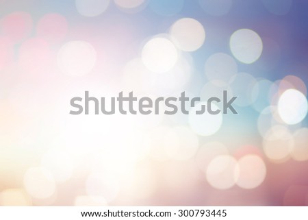 abstract blurred backgrounds of twilight backdrop with circle lights in pastel tone colour.blur of circle light christmas festive backdrop concept.