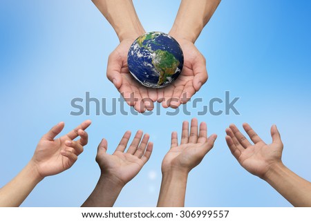 hands reaching the world for heal together, save the world concept ,Elements of this image furnished by NASA.international day concept:environment and ecology concept.