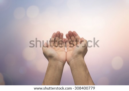 Human\'s hands pray on blurred nature background : helping hand concept.hand of god giving the power to human\'s hand., soft focused
