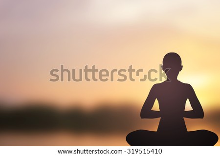 Silhouette of asian woman in yoga over blurred sunset twilight sky backgrounds : asian woman in yoga pattern exercise for healthy life :concentrate woman yoga concept.concentrate and power concept.