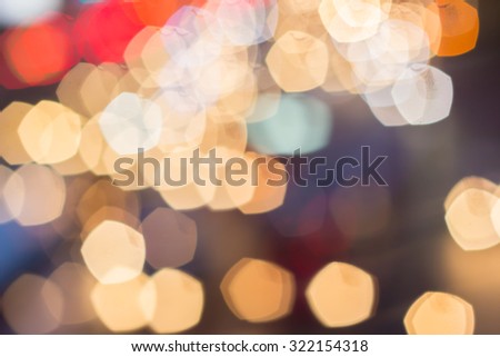 Abstract blurred colorful of traffic circle light backgrounds:blurred night city with colour ploygon bokeh light:blur bokeh light christmas festive backdrop concept:out of focused concept:blur concept