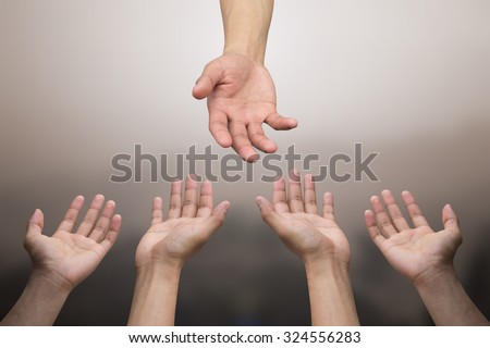 close up of human hands praying for helping:hand of god blessing and help to all pray.abstract helping hand over sepia vintage tone colors backgrounds concept.helping hands concept:religion concept.