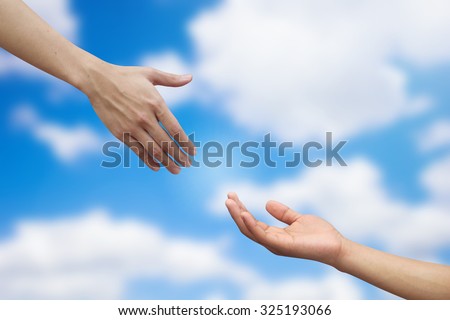 helping hand and hands praying on blurred colorful background , helping hand concept.healthcare and healing concept.hand of god giving the power of life to human's hand.