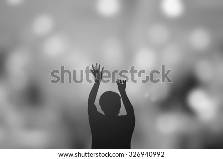 silhouette man praying over blurred twilight sky backgrounds.man pray to god for receiving power,strong and protect and blessing.religious concept.
