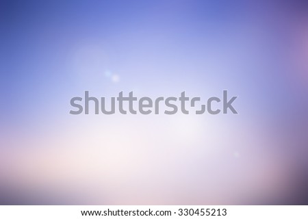 blurred backgrounds of sea with flare lights.blurred backgrounds concept:blur of sunset sky wallpaper backdrop:pastel tone styles colours.spring and summer concept.