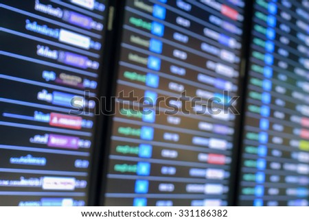 blurred soft display flight plane schedules board backgrounds at airport:blur of information international or domestics flight boarding time and arrival time:blur of airplane flight.