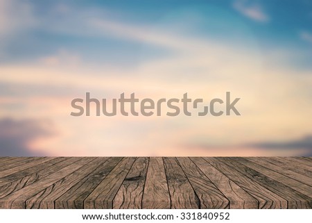 blurred nature sunset sky backdrop wall with old vintage grungy beige brown wood line backgrounds textures tabletop:rustic aged tiles wooden with blur backdrop.put,show your products on this display