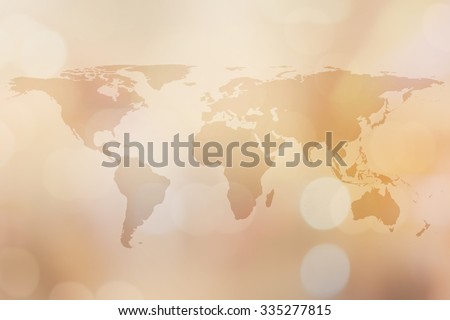 World map on golden blurred backgrounds with bokeh.blurred shiny gold colored backgrounds:blurry shining gold colour map of earth wallpaper backdrop:blurred backgrounds concept.cream tone styles.