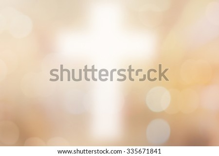 abstract blurred christ cross over bright gold cream color background with bokeh circle lights:blur religious backdrop concept:blurry power of religion conceptual.preach the gospel ideal:prayer symbol