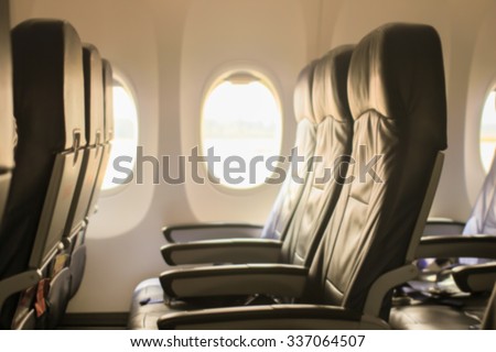 abstract blurred of seat in the airplane low cost conceptual:blur of seat in the cabin:blurred of empty seat in the aircraft:picture with instagram filter effect.nice trip concept.