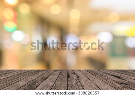 old vintage grungy red brown wood tabletop with blurred warm light colored backgrounds:grunge aged wooden paving with blurry warm cream light bokeh backdrop.put and show your products on this display.