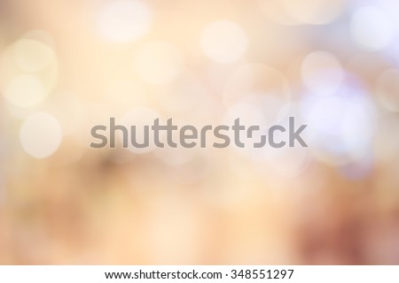Blur shining brighten wallpaper with circle lantern:abstract blurred background in warm light colour toned.blurry bulbs ball motion of golden/yellow colored backdrop.blurry wedding ceremony concept.