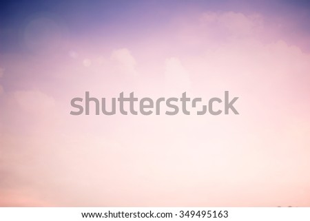 abstract blur color sunset backgrounds with shiny lens flare light:blurry soft of pink and purple colored in vintage tone:blurred natural backdrop concept:blur of pastel color with shine conceptual.