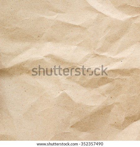 crumpled paper texture for background in sepia light tone:rough and jagged of page paper backdrop:brown and tan colored creased carton wallpaper.rumpled and folded wallpaper template.square image.