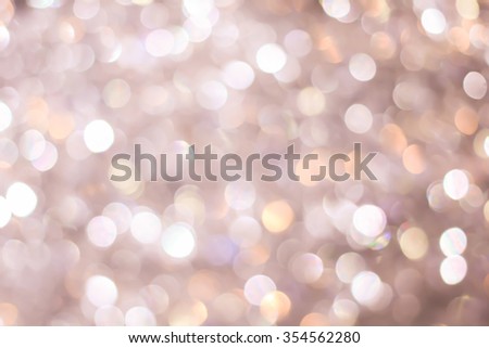 abstract blurred of sepia vintage and bronze glittering shine bulb lights background:blur of Christmas day wallpaper decoration concept.xmas design festival backdrop:sparkle circle celebration display