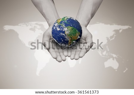 Two hands holding the earth in palm gesture on blurred white map sepia brown color gradient background:world business concept:Elements of this image furnished by NASA.safe and healing world concept.
