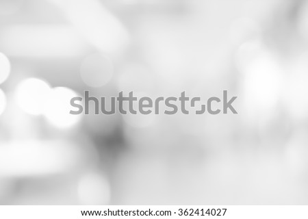 abstract blurred white/grey color corridor indoor office room background:blurry workplace factory backdrop concept:blur light and soft wallpaper with bokeh light:soft focus indoor working center.
