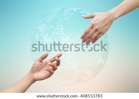 close up people hand reaching together for developing a new world concept:risk of global warming:solution for healing and safe global life idea:helping hand:Elements of this image furnished by NASA