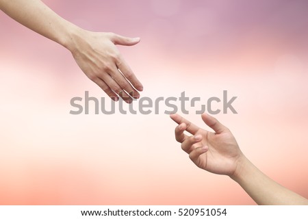 close up man hands reaching together:helping hand concept