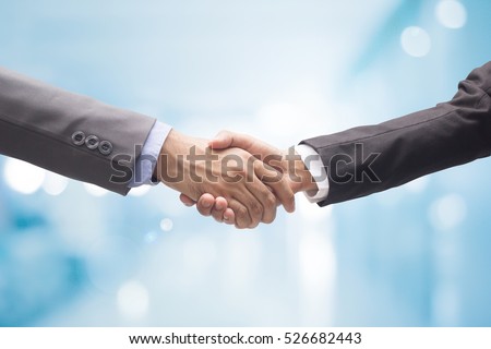 close up business man handshake together on blur background in :agreement,accept,approve financial cooperative concept.improve/development.trust,goal,team,hand,shake:international  investment:success