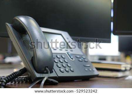 close up soft focus on telephone devices at office desk.