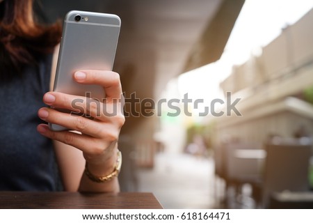 close up hand hold mobile cell phone device:focus on girl call text on smartphone concept:teen people type digital content.teenager response answer chat friends:relax vacation.iot internet of thing