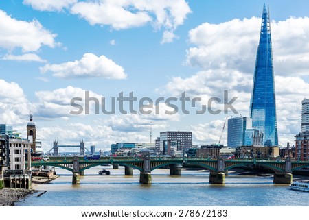 LONDON - APRIL 11: Overview of London with the Shard of Glass on April 11, 2015 in London, UK. Standing 306 metres high, the Shard is currently the tallest building in the European Union.