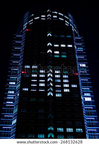 Urban lights: rhythm of lights in a modern facade in Frankfurt, Germany, at night