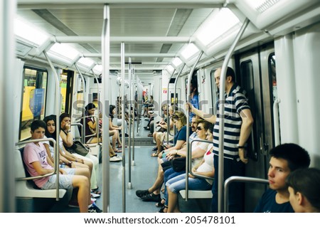 BARCELONA, SPAIN - JULY 13: People travels by Metro Barcelona on July 13, 2014 in Barcelona, Spain. Metro Barcelona is an extensive network of electrified railways that run underground in Barcelona.