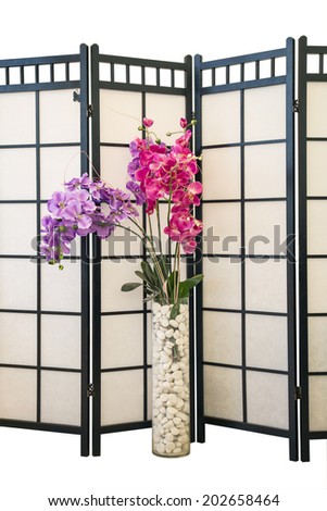 purple and pink orchid flowers on a background of the screen in the interior. interior Design