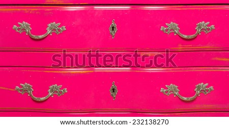 close-up, old wooden furniture pink dresser drawers to store items and securities
