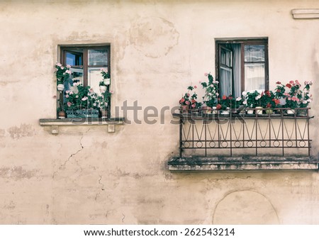 open window, balcony with flowers on the windowsill, in the old style photo image.
