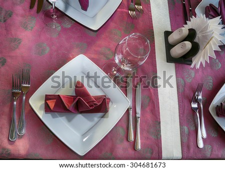banquet table, cutlery, plates, china, napkins. celebration, fragment